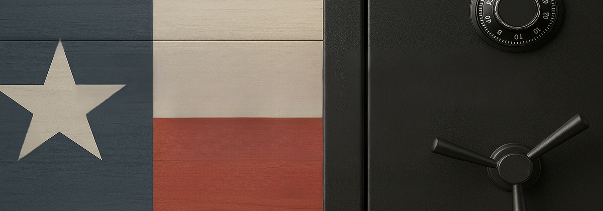 Close-up of a Texas flag and a black safe with a handle.